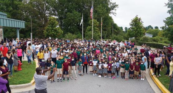 The SAA community gathers at the flagpole on the first day of school to celebrate and pray together. Spencerville Adventist Academy
