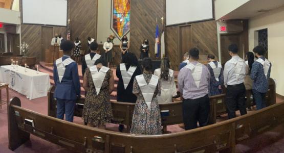 Inductees from the three partnership schools— Lake Nelson, Vine Haven and Waldwick—bow their heads in prayer as they are welcomed into the high school National Honor Society. Lake Nelson Adventist Academy, Vine Haven Adventist School, Waldwick Adventist School