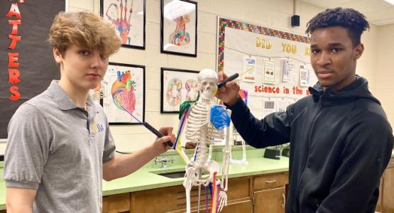 Junior Isaac Collier and Senior Brandon McDowell use 3-D pens on a skeleton. Spring Valley Academy, 3-D Pens
