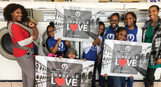 Members of Allegheny East Conference's Miracle City church in Baltimore provide "Loads of Love" (free laundry) to members of the community.