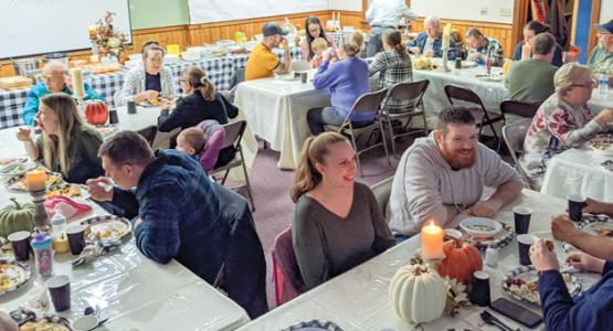 Mountaintop and community members fellowship together over a Thanksgiving meal.