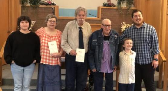 Daniel Venegas (far right), pastor of the Buckhannon church, introduces the newest members to the congregation, (left to right) Hanna Welch, Sheri-Lyn Sapp, Alan Wingfield, Benny Shifflett and Vann Parker, following their baptisms.
