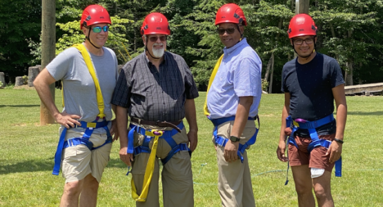 Bob Cundiff, Ohio Conference president; Tim Bailey, Mountain View Conference (MVC) president; Marcellus T. Robinson, Columbia Union Conference president; and Walter Cardenas, assistant to the MVC president, prepare for the ropes course.