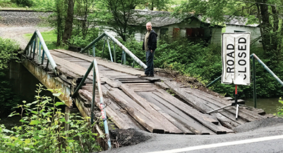 A flash flood in 2015 destroyed this bridge, making it nearly impossible for 13 Pigeon Creek families to get access to food and medical care. A flash flood in 2015 destroyed this bridge, making it nearly impossible for 13 Pigeon Creek families to get access to food and medical care.
