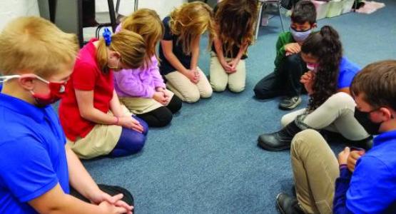 Students from the Mountain View Christian School in South Williamsport pray together. Students from the Mountain View Christian School in South Williamsport pray together.