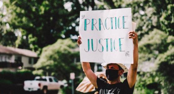 Pastor Munoz, associate pastor at Seabrook church, participates in a march for racial justice. Photo by Peter A. Roberts