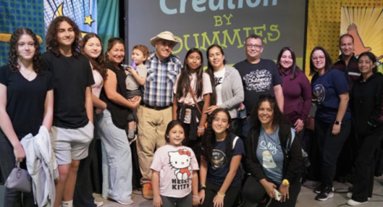 Rich Aguilera (pictured in hat), founder of One Mustard Seed, is flanked by Children’s Festival attendees. Rich Aguilera (pictured in hat), founder of One Mustard Seed, is flanked by Children’s Festival attendees.