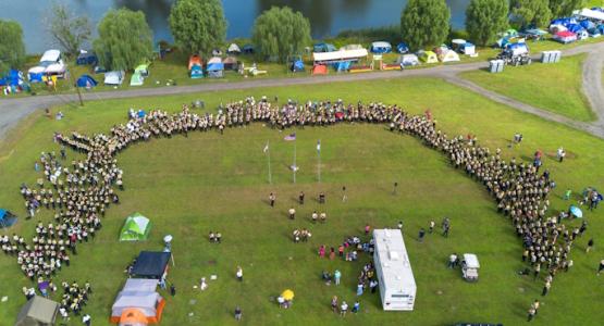 New Jersey Conference Pathfinders stand together during a flag raising ceremony. Pathfinders Experience ‘Faith on Fire’ at Camporee, New Jersey Conference, Teen Leadership Training Sermon Showdown, Aby Jimenez