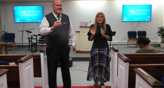 Speaker Ron Lynch from LIGHT talks about the benefits of health training, interpreted into Spanish by Rossana Benavides, a Hackettstown church member.