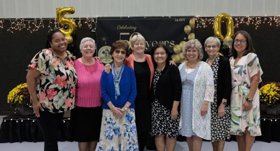 Past and present Tranquility Adventist School educators Adrienne Broomes, Nita Connell, Violet Bata Niederoest, Barbara Delaney, Margie Ramirez, Tammy Danitz and Linda Gang celebrate the school’s 50th anniversary with Elaine Lopez (far right), current principal. Tranquility School Celebrates 50 Years, New Jersey Conference, Elaine Lopez, Elisa Maragoto