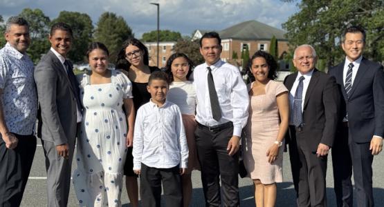 Yuri Stefanny Bayern (third from the left), accompanied by her husband, Yeiferson Trujillo (second from the left), and their three children, are joined by New Jersey Conference pastors and leaders as they praise God for transforming the family’s life. From Despair to New Life in Jesus, Yuri Stefanny Bayern, Yeiferson Trujillo, Paterson South Spanish church, New Jersey Conference