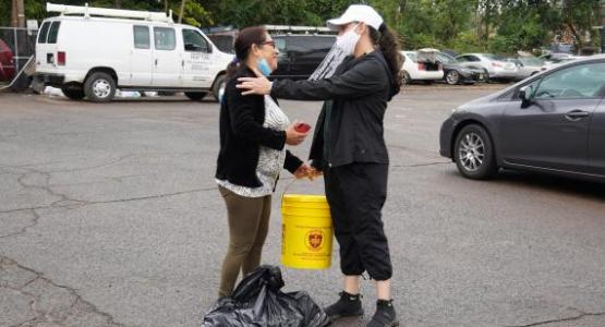 A New Jersey Conference volunteer greets one of the Hurrican Ida survivors.