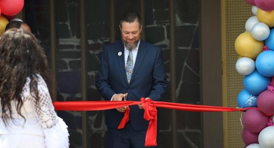 Bob Cundiff, Ohio Conference president, cuts a ribbon, dedicating the new Greater Cleveland church’s new building. Church Dedicates Building, Michael Opuni-Asiedu, Hosts Fundraising Event, Ghana, Bob Cundiff, Conference, Greater Cleveland church