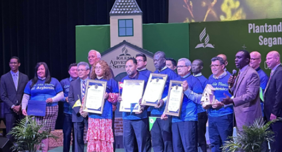 In recognition for their efforts in church planting, leaders Elian Maldonado from the Cincinnati church plant; Luis Roque from the Vandalia church plant; Clerius Joseph from the Haitian church plant; and Augusto Perez from the Middletown church plant, hold certificates.