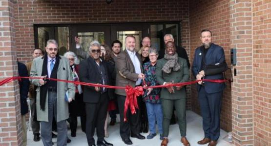 Dave Pate, project manager; Shaun Lazarus, school principal; Rick Bianco, conference education superintendent; Katie Swackhamer, school board chairperson; Kojo Twumasi, Toledo First church pastor; and Bob Cundiff, conference president, take part in the ribbon-cutting ceremony