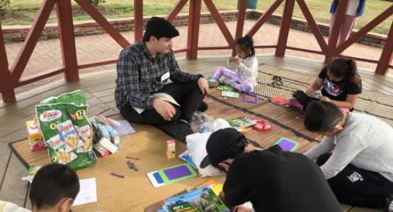 CORE student Matthew Ullom tells Bible stories to refugee children during a recent mission trip.