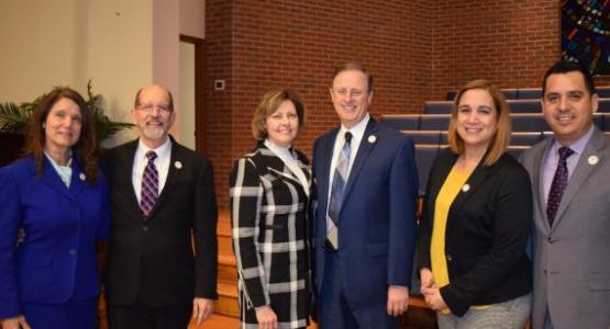 Conference officers re-elected pose with their wives at the constituency session: Will Peterson, executive secretary, and his wife, Darlene (left); Gary Gibbs, president, and his wife, Sherilyn (center); and Carlos Charnichart, treasurer, and his wife, Liz (right). 