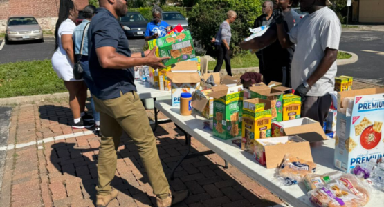 Volunteers distribute food at an ACS site hosted by Berean Seventh-day Adventist Church in St. Louis, supporting residents impacted by the May 16 EF-3 tornado. Photo courtesy of Outlook magazine | Mid-America Union