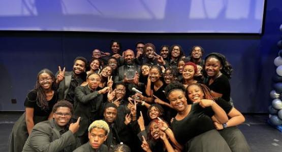Flanked by the Pine Forge Academy choir, Director Jarrett Roseborough and choir member Kaitlyn Lyseight-Shields (’25) hold the awards for Best Youth Choir and Best Overall Performers at WHYY’s Lifting Voices in Praise Gospel event.