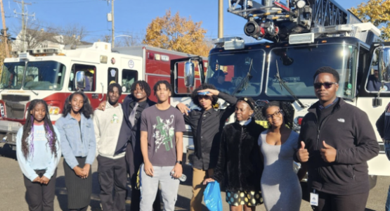 Nathan Henry (right) and other PFA students prepare to explore the inside of fire trucks during the “Childrens’ Story Hour,” hosted by the Walnut Street Community church.