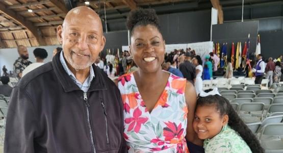 Alumna Tiffany McNealy (’88), who established a scholarship to benefit students who wish to attend Pine Forge Academy, stands with her father, T. A. McNealy, and niece, Siobhan. 