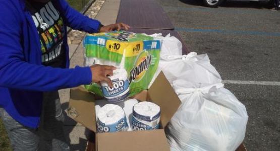 Celia Archie prepares a food basket for Mount Olivet seniors.