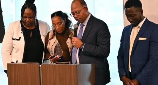 Celeste Blyden, Marcellus Robinson and Emmanuel Asiedu surround Gina Brown as she prepares to serve as president of Oakwood University. Celeste Blyden, Marcellus Robinson and Emmanuel Asiedu surround Gina Brown as she prepares to serve as president of Oakwood University.