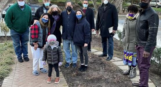 The Pandemic Comforters visit Rep. Jamie Raskin and his family (center) after the loss of their son.