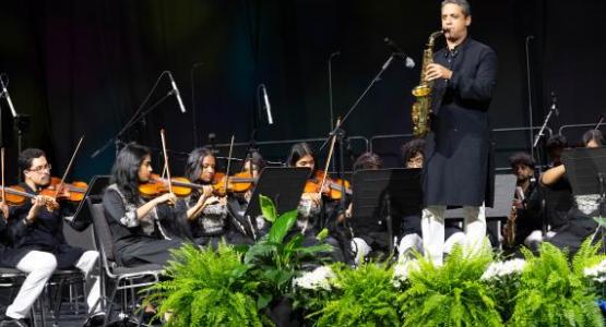Saxophonist Douglas Lira and the Southern Asia church's orchestra play "Mine Eyes Have Seen The Glory." Photo by Elsie Tjeransen/AME (CC BY 4.0) 