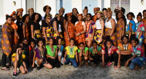 Attendees of the first Cultural Heritage/Awareness Day wear traditional African attire, that, as one camper puts it, “made us look and feel like royalty.”