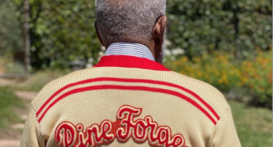 Everard Williams (’57) proudly wears his vintage class sweater at the reunion. Everard Williams (’57) proudly wears his vintage class sweater at the reunion.