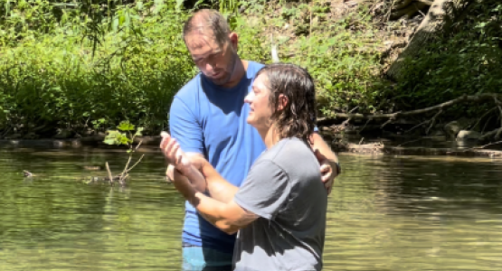 Matthew Haire, pastor of the Morgantown (W.Va.) church, baptizes Alan Ayala at the New Believer’s retreat.