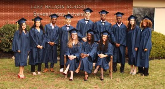 The first LNAA high school graduating class: (left to right) Karissa Osorio, class secretary*; Tania Tumundo, class treasurer*; Daniel Colón; Brendan Sierra, Student Association sports coordinator*; Juan Fernandez; Lyden Stanislaus-Niles, Student Association treasurer; Elinihaki Ngoye; Jenny Pontarelli, class vice president*; Taylore Williams; (sitting) Bethany Washburn; Naomie Charles, Student Association president*; Graciela Gonzales, class president* (Antonio Bermudez, not pictured) *NHS