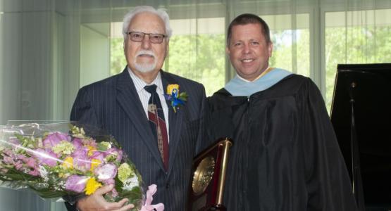 Spring Valley Academy Principal Darren Wilkins honors Frank Perez, chair of SVA’s Board of Trustees since 2008, for his leadership, insight and wisdom. Spring Valley Academy, Frank Perez, Darren Wilkins