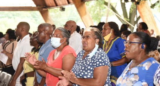 Camp meeting attendees lift their voices in praise under the Luther R. Palmer Pavilion Allegheny East Conference, Camp Meeting, Luther R. Palmer Pavilion,