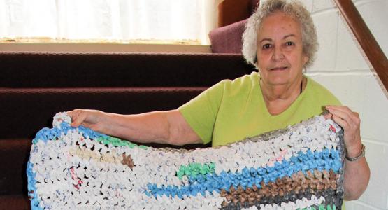Shirley Crouser shows a soft mat made from colorful plastic grocery bags which will bring warmth to a homeless person. Shirley Crouser shows a soft mat made from colorful plastic grocery bags which will bring warmth to a homeless person.