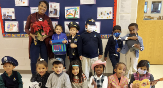 Elementary students express their individuality and creativity by dressing in attire that represent their desired future careers, pictured with kindergarten teacher Lynette Sigh.