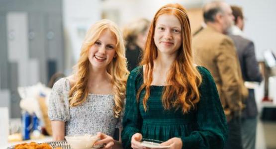 Eighth-grader Violet Bennie and seventh-grader Annie Hill serve appetizers during the first hour of the event. Eighth-grader Violet Bennie and seventh-grader Annie Hill serve appetizers during the first hour of the event.