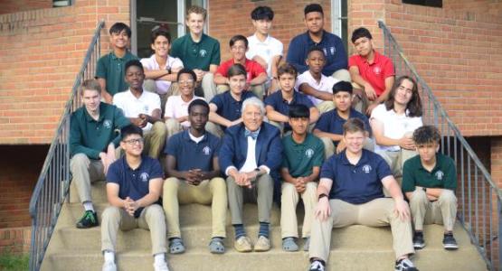 The Freshman Boys Life Skills class sits with Buz Menhardt, associate pastor of the New Market church.