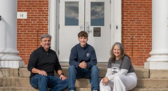 The Williams’ Family—Tony (’82), Theron (’27) and Tracey—share a moment in front of the boys’ dorm.