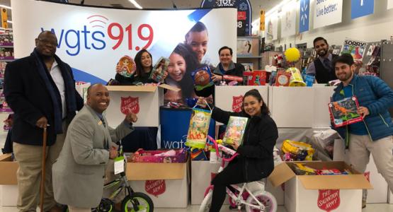 The WGTS 91.9 Community Engagement Team celebrates a successful toy collection.