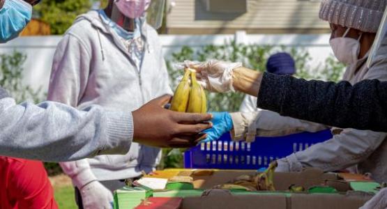 Volunteers distribute food at the food pantry at Allegheny East Conference's Church of the Oranges. Photo by Stuart Richardson Volunteers distribute food at the food pantry at Allegheny East Conference's Church of the Oranges. Photo by Stuart Richardson