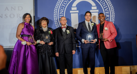Dr. Weymouth Spence, WAU president, is flanked by the four honorees who were awarded for their service in action during the 12th Annual Visionaries Gala. 