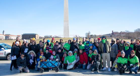 WGTS staff and listeners gather on the National Mall to cleanup the WWI Memorial