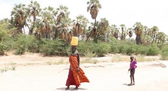 Woman and child walk miles to ferry water. Photo: © 2021 ADRA | Horn of Africa