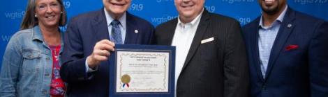 Mayor Bridget Newton (left), and councilmembers Sidney Katz and Will Jawando (right), declare August 23, 2019, "WGTS 91.9 Day," awarded to President and General Manager Kevin Krueger (second from right).