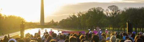 The sun rises over the Washington Monument.