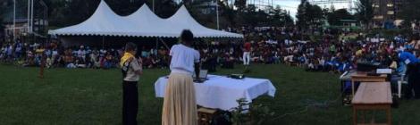 Dillon Smith, 12, speaking to about 1,000 people at a park in Karongi, Rwanda, on Sunday evening. (Jackie O. Smith) via Adventist Review