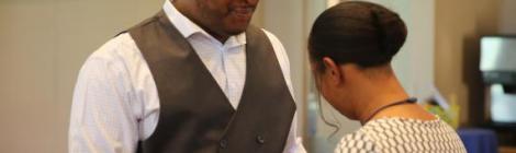 Marleena Debrough, pastor of the Prentis (Pa.) Park church, anoints and prays for Kevin Jenkins, a CAMCON attendee and member of the Southwest church in Philadelphia.