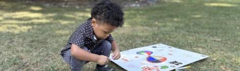 A toddler spends time in nature during Beltsville church's Sabbath outing at the Mt. Aetna Retreat Center.
